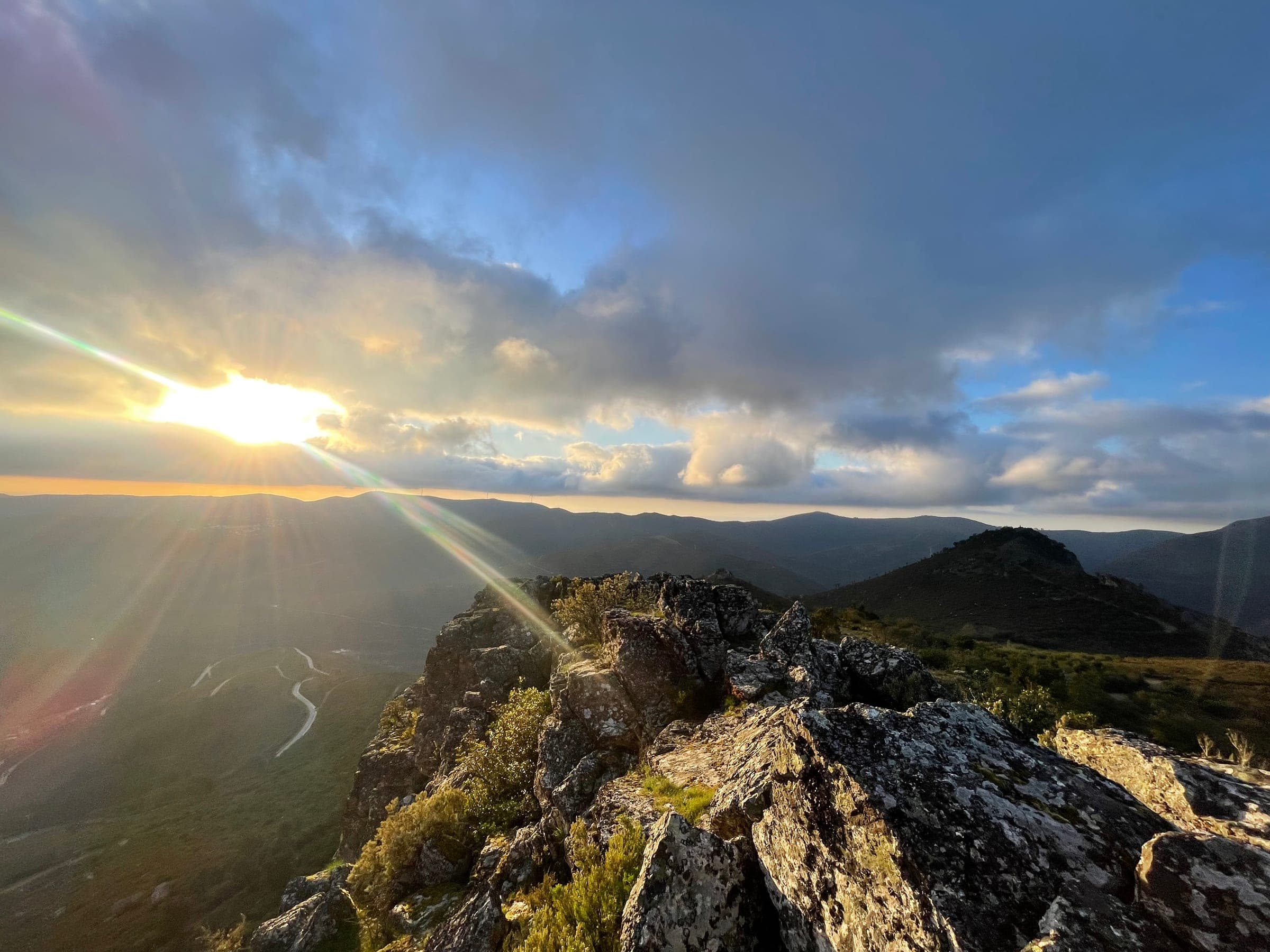 Sunset seen from the rocky ridge above the valley